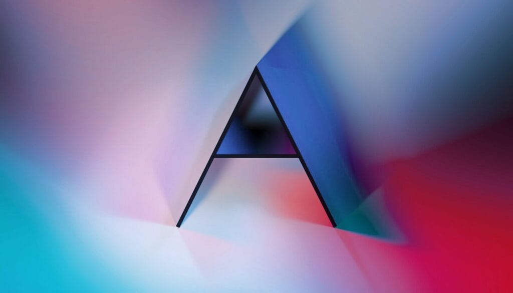 A large, stylized letter A stands against a blurred, colorful background with shades of blue, pink, and red, creating a soft, abstract, and modern visual effect.
