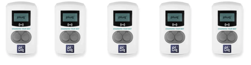 Five identical white electric vehicle charging stations with digital screens and two gray circular sockets each, arranged in a row against a white background. The word pluq is visible on each device.